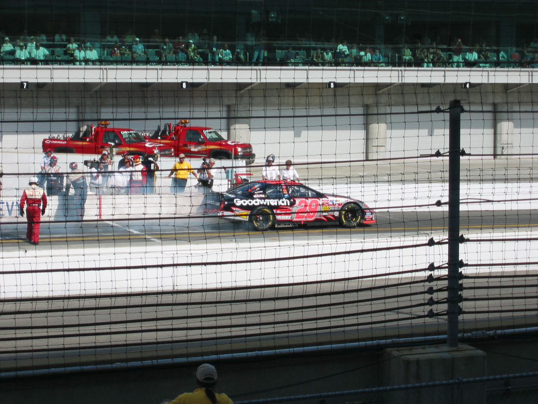 Brickyard 2003 32 - Harvick Smokin out of pits